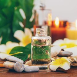 Spa oils with plumeria flowers. Selective focus. Natural.